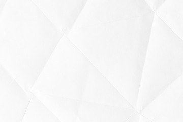 Texture of old crumpled origami paper, white background in modern style. 3D shapes of curved lines for patterns and wallpapers.
