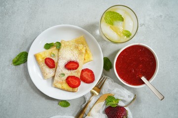 Homemade sweet Crepes with ricotta filling / Thin pancakes with cheese stuffing