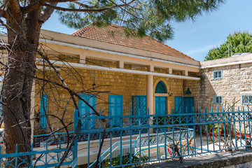 This is a capture of the old roads in Der El Kamar a village Located in Lebanon and you can see in the picture the old walk made of stones with an historic architecture for walls and houses 