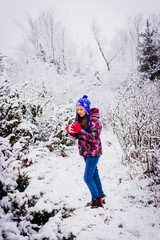 Girl Playing in the Snow with Her Dog