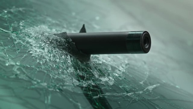 Rifle with silencer out of the car. Rifle shooting. Fully equipped sniper. Secret mission, Operation in Action. Slow Motion. 4K. UHD.