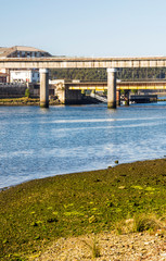 Naklejka premium Bridge in the ocean in a sunny day in the north of Spain.