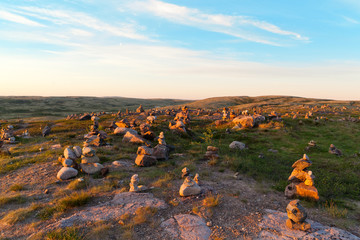Magic stone pyramids at dawn in the tundra on the north of Russia
