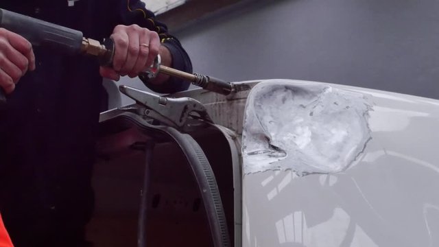 auto body repair in a garage