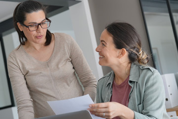 Women working in office on laptop computer