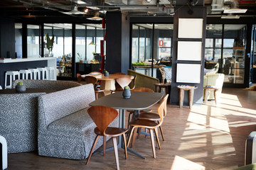 Furniture in the eating and casual meeting area of a creative business in daylight, no people