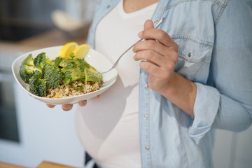 Closeup of veggie bowl, pregnancy