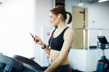 Cute girl exercising in gym