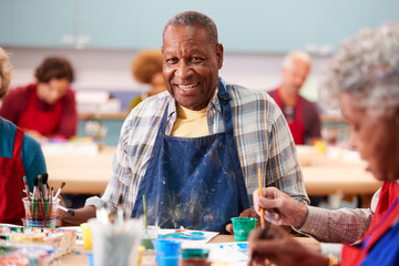 Portrait Of Retired Senior Man Attending Art Class In Community Centre - Powered by Adobe