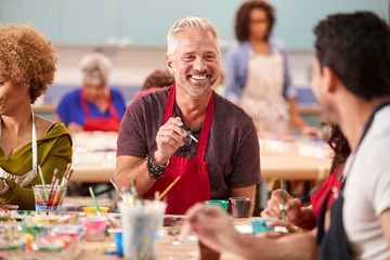 Group Of Mature Adults Attending Art Class In Community Centre © Monkey Business