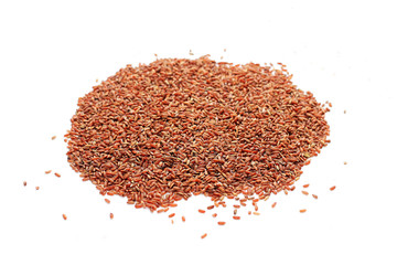 brown rice scattered on a white background