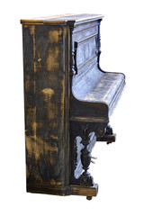 Old-fashioned antique ornamental piano with carved pillars. Before restoration