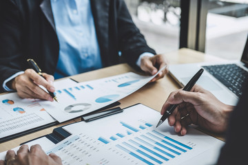 Two executive discussing company growth project success financial statistics, Partner meeting professional investor working start up project for both company with document, laptop and digital tablet