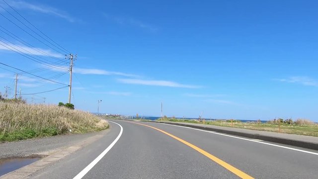 Driving picture. Slow curve near the sea