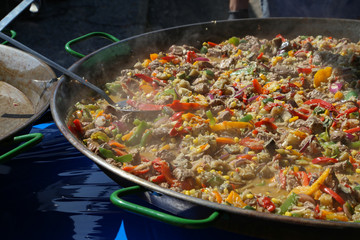 A dish of rice, vegetables and meat