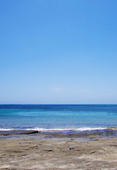 Fototapeta na wymiar Blue sea landscape with sky on the horizon. Calm ocean waves summer tropics lagoon.