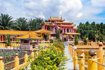 View of a beautiful chinese temple in Seen Hock Yeen Confucius Temple in Chemor, Perak, Malaysia from flowery walkways.