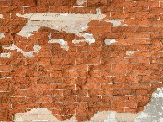 Old Brick Wall Texture. Painted Distressed Wall Surface. Grunge Red Stonewall Background. Shabby Building Facade With Damaged Plaster