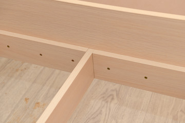 Assembling furniture from chipboard. Fastening furniture parts.