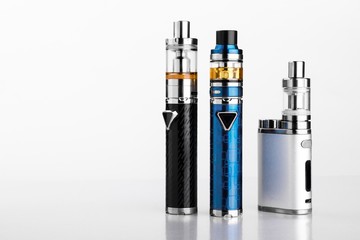 electronic cigarettes or vaping devices on white background