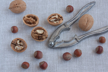 walnuts and hazelnuts and a Nutcracker on linen tablecloths
