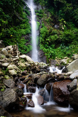 Fototapeta premium Beautiful scene of Semirang Waterfall with lovely smooth water. A Waterfall which is a tourist destination in the city of Ungaran, Semarang, Indonesia.
