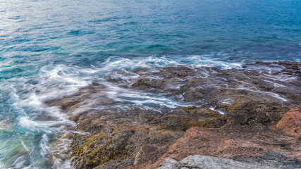 Long Exposure of waves crash on the rocks