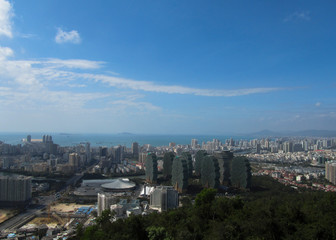 Fototapeta premium China, Hainan Province, overlooking the city of Sanya, in the foreground The Beauty Crown Grand Tree Hotel. Horizontal photo