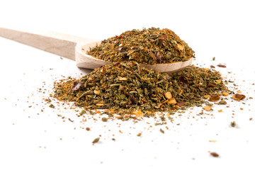 red savory mix or Chubritsa on wooden spoon on white background