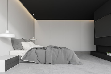 White bedroom interior with TV set