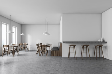 White cafe interior with sofa and bar