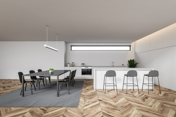 Interior of white kitchen, table and bar