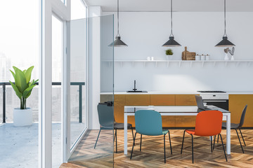 Bright colored kitchen interior with balcony