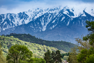 landscape with green hills and snowy mountains, Almaty, Kazakhstan