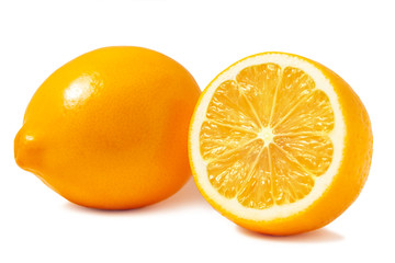 Fresh orange Tashkent lemons or Meyer lemons, one whole and one half isolated on white background...