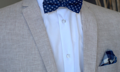 classic style beige suit blue bowtie elegant menswear