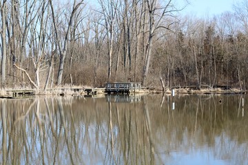 The dock and the reflections off the lake water.