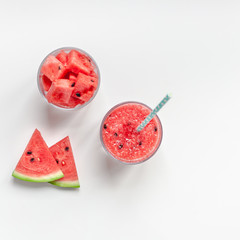 Watermelon smoothie with crushed fruits in glasses