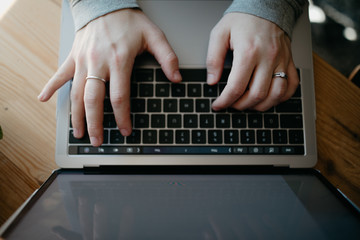 Fototapeta na wymiar woman typing on laptop