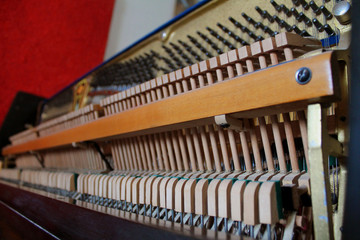 the insides of an old vintage piano details from the inside
