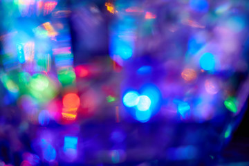 Yak background of multicolored spots of light in defocus