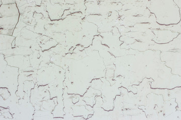 Background from peeled beige oil paint.