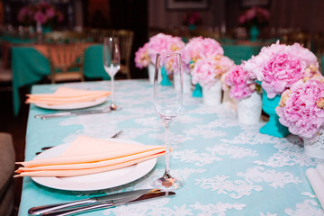 Beautiful bright bouquet of peony on the wedding table in vase
