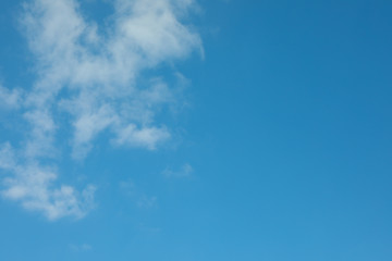 Fototapeta na wymiar Beautiful white fluffy clouds on a light blue sky background. Wonderful skies