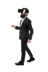 Full length portrait of a bearded businessman in virtual reality glasses, isolated on white background