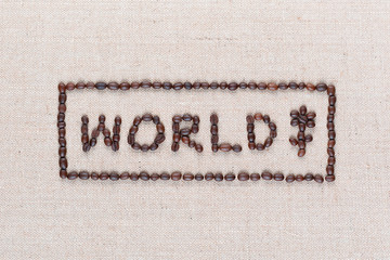 World sign made from coffee beans on linea texture aligned in center, shot close up.