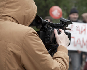 Cameraman With Digital Video Camera, press work