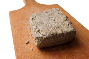 sunflower halva on a wooden board, oriental sweets concept