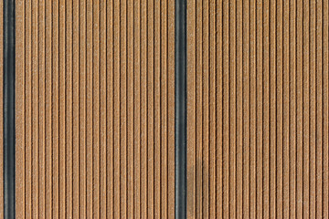 close-up Texture of yellow wood lath wall with black lines. Wooden planks background.