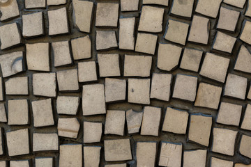 Abstract geometric mosaic with pale yellow tiles. vintage ethnic mosaics texture.